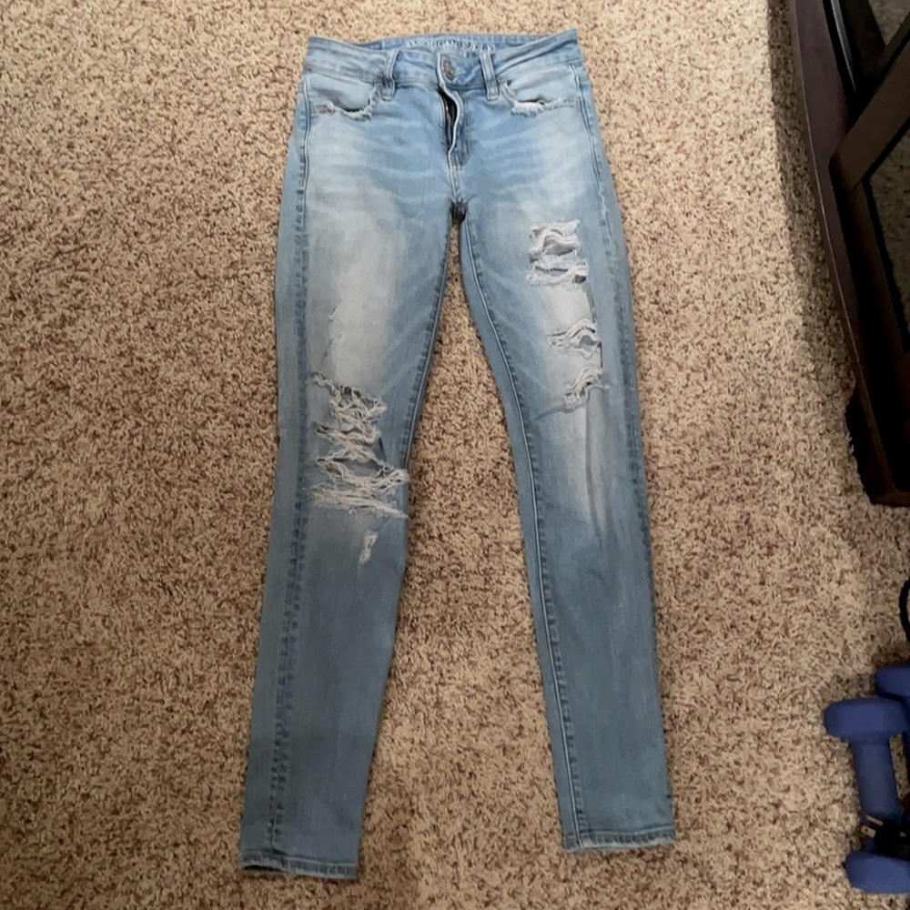 Light blue American Eagle mid-rise ripped jeggings